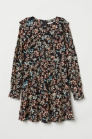  Patterned frilled dress 32.00 €
