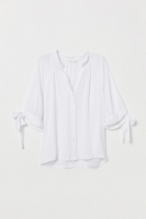  Tie-sleeved blouse 6.00 €