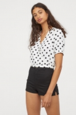  Wrapover blouse with ties 10.00 €
