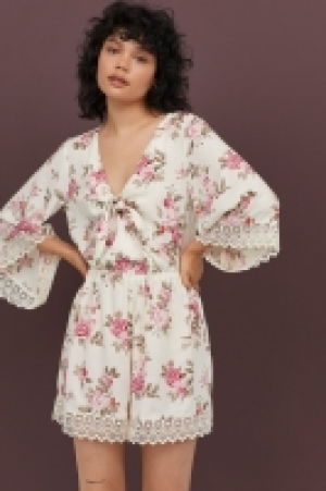  Playsuit with lace 17.99 €