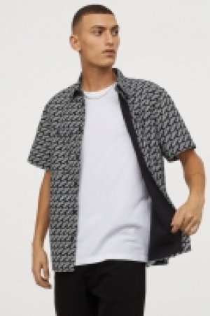  Short-sleeved cotton shirt 9.99 €
