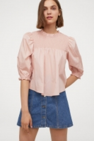 Smocked cotton blouse 7.99 €